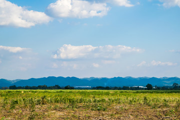 farm and a far mountain