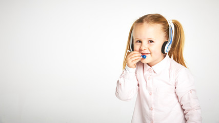 Young cheerful female customer support operator with headset and