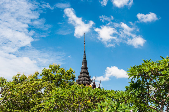 view pagoda with blue sky background in Buddhist temple Thailand.