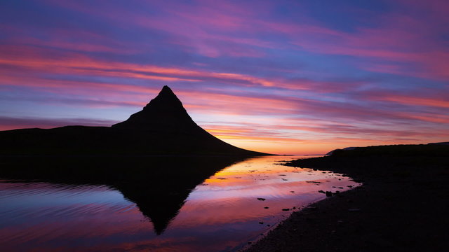 Colorful Sunrise Timelapse with Mountain Silhouette and Reflection. Iceland.