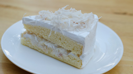 Coconut cake on white plate
