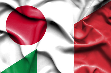 Waving flag of Italy and Japan