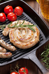Grilled sausages and beer mug