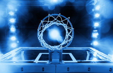 Basketball Hoop in a sports arena (blue toned) - obrazy, fototapety, plakaty