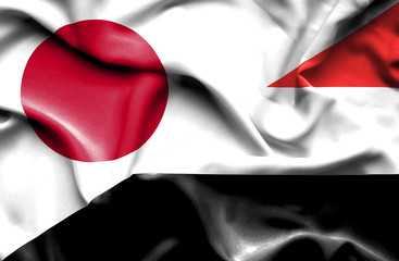 Waving flag of Yemen and Japan