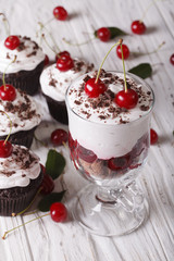 Dessert cherry black forest and cupcakes close-up. Vertical
