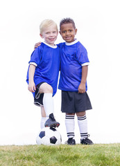 Two diverse young soccer players on white background. Full length view of two youth recreation...