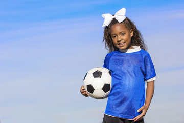 Fototapeta premium Smiling young african american soccer player portrait with lots of copy space