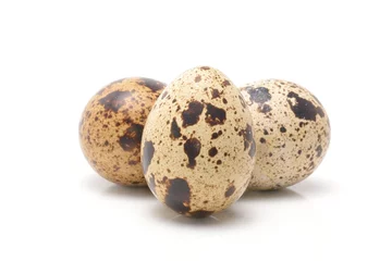 Zelfklevend Fotobehang quail eggs isolated on white background © remus20