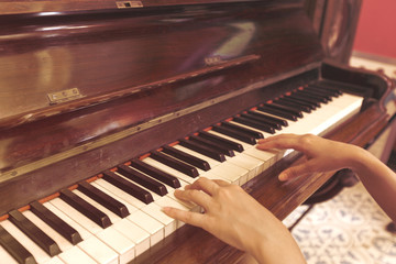 Fototapeta premium Women Hand playing antique piano classic