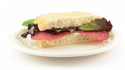 focaccia salami and salad on dish