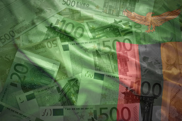 colorful waving zambian flag on a euro money background