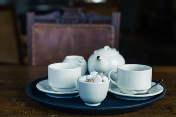 Teapot, cup and sugar on tray