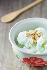 ice cream with peanuts in ceramic bowl