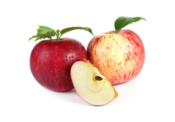 fresh red apples with leaves isolated on white background