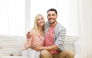 smiling happy couple at home