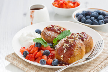 sweet cheese pancakes with fresh berries and cream