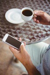 Close up view of businessman texting