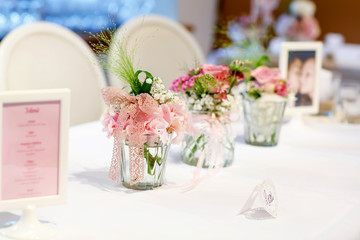 Table set in pink and white for wedding or event party.