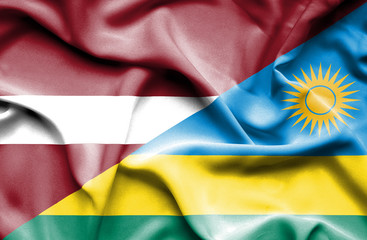 Waving flag of Rwanda and Latvia