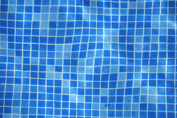 Beautiful azure turquoise colored clear transparent pool water out of focus