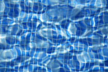 Fototapeta na wymiar Sun reflected in the swimming pool water as a background