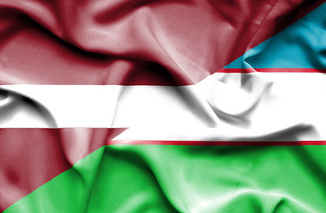 Waving flag of Uzbekistan and Latvia