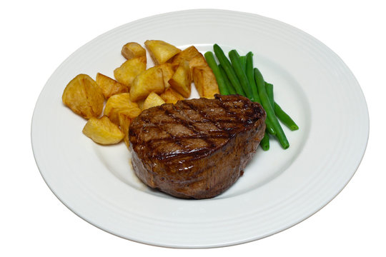 Fillet Steak with Beans and Potatoes on a White Plate