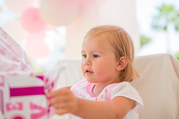 Excited Cutie Unwrapping Her Birthday Present