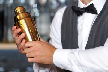 Handsome bartender during work