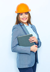 Business woman wearing a building protect helmet, holding busin