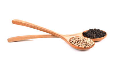 Black Pepper ,White Pepper Corns in wooden spoon isolated white