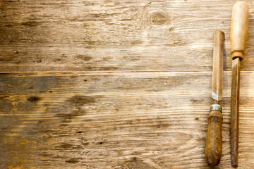 various different steel retro rusty rasp file tool collection isolated on wooden background. Copy...