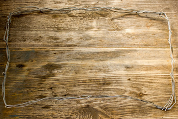 Rope and Textured Wood, Coil of rope set against highly textured wood. Copy space to right.