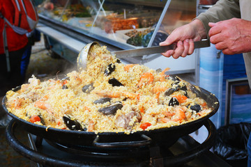 Cooking of paella on food festival