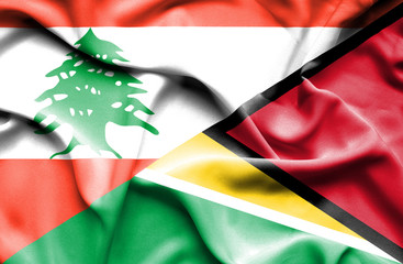 Waving flag of Guyana and Lebanon