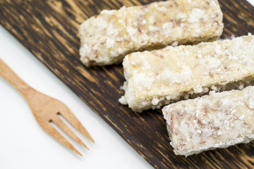 Chinese and Thai dessert of sweet taro fried on palm wood dish