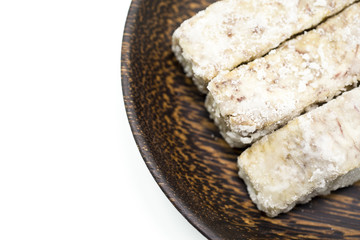 Chinese and Thai dessert of sweet taro fried on palm wood dish