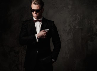 Tough sharp dressed man in black suit