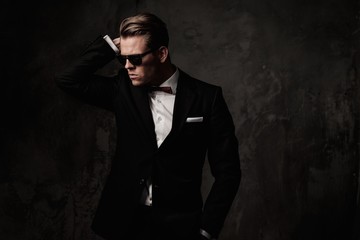 Fototapeta premium Tough sharp dressed man in black suit