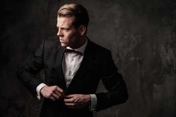 Tough sharp dressed man in black suit