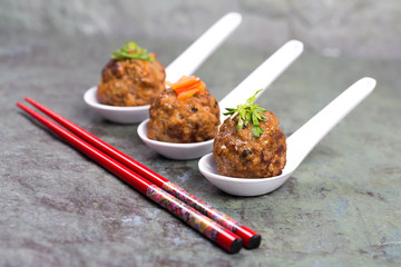 Asian meatballs and chopsticks