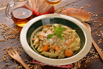 Penne rigate with carrots and cereals
