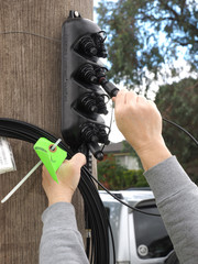 Hobart, Australia - 2015, April 12: Customer premises connection drop cable being plugged into a...