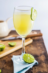 Lime Juice on wooden background