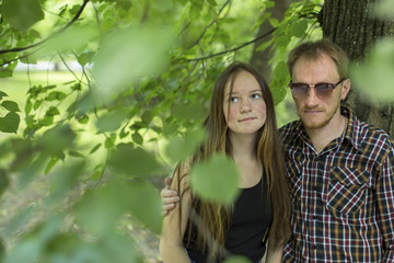 Portrait of young couple standing in a Park.