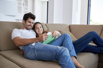 couple at modern home using tablet computer