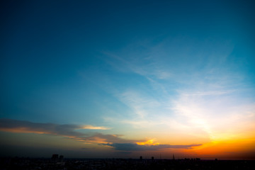 Sunset sky in urban with silhouette city
