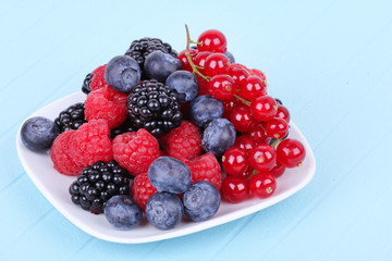 Different berries on plate