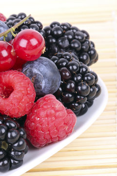Different berries on plate, closeup